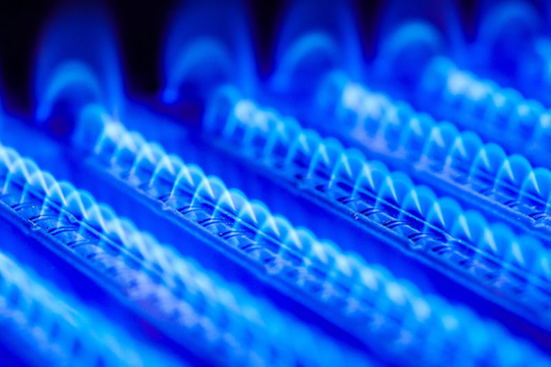 How Can I Make My Furnace Last Longer? Close up photo of a furnace's heating coils with a blue hue.